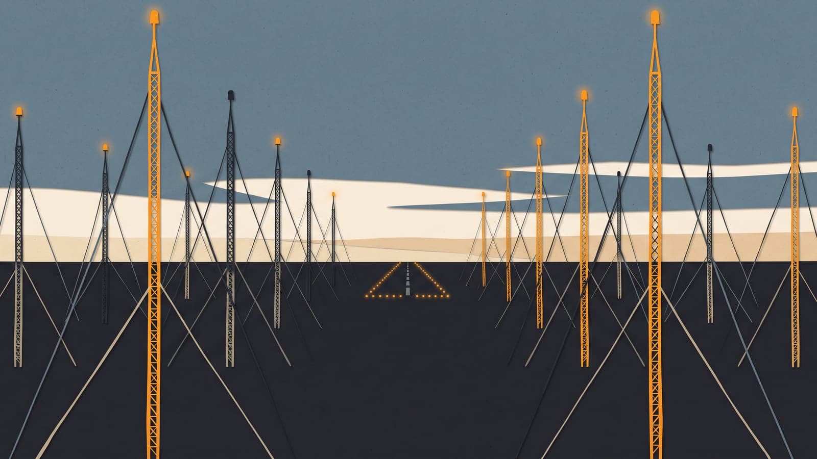 Dusk view over a plain crowded with radio towers, most topped with red lights and a few unlit, a lighted runway in the distance.